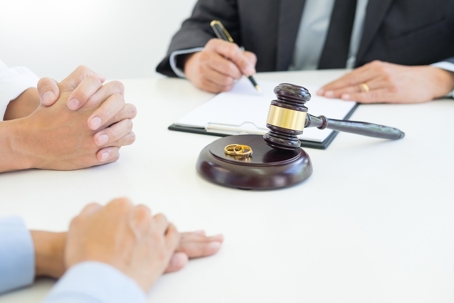 divorcing couple consulting with a lawyer