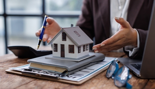 Business woman signing contract making deal with real estate agent for consultant home insurance Real estate investment Property insurance security. Real estate agent concept .