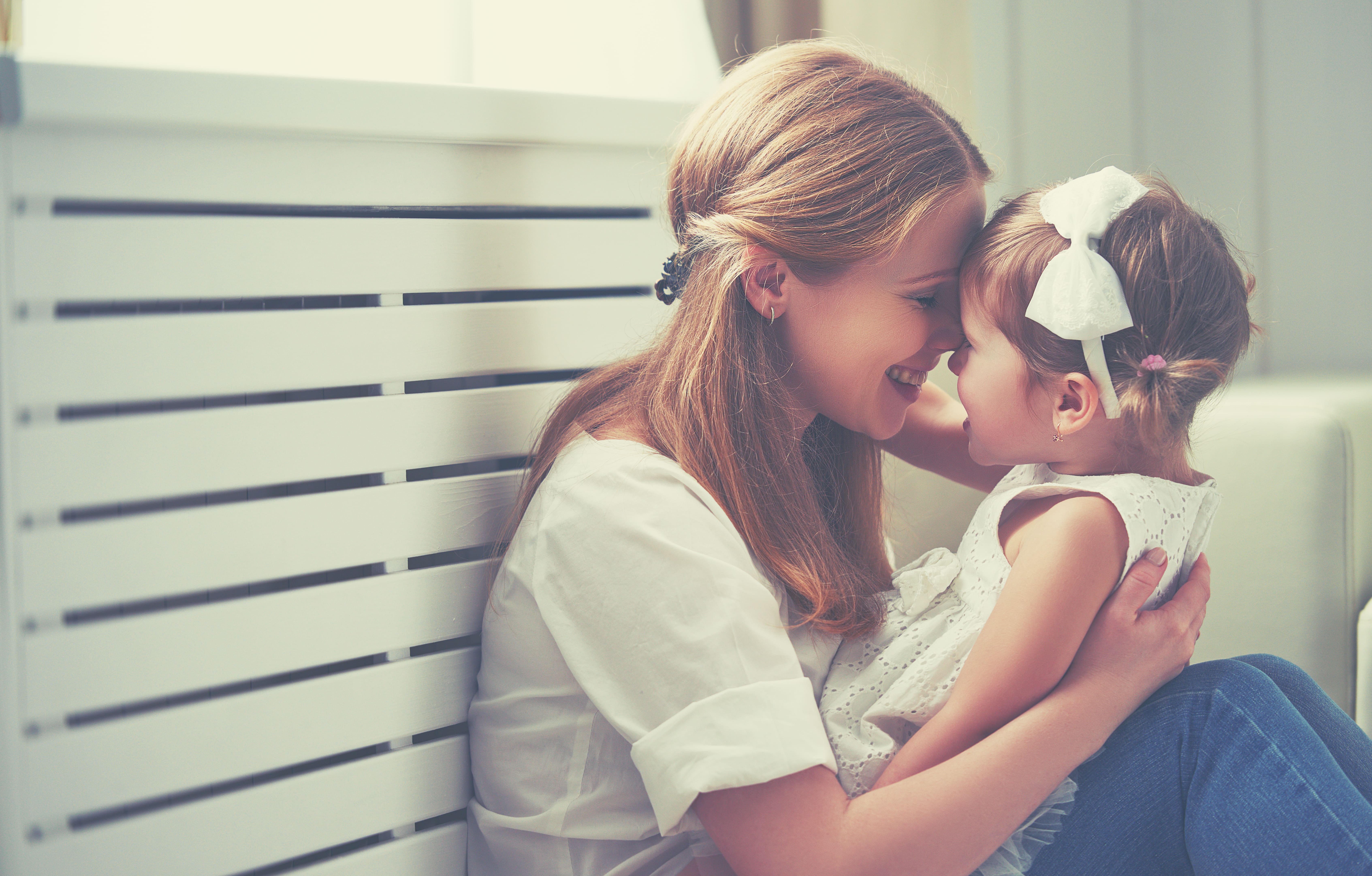 mother holding her daughter